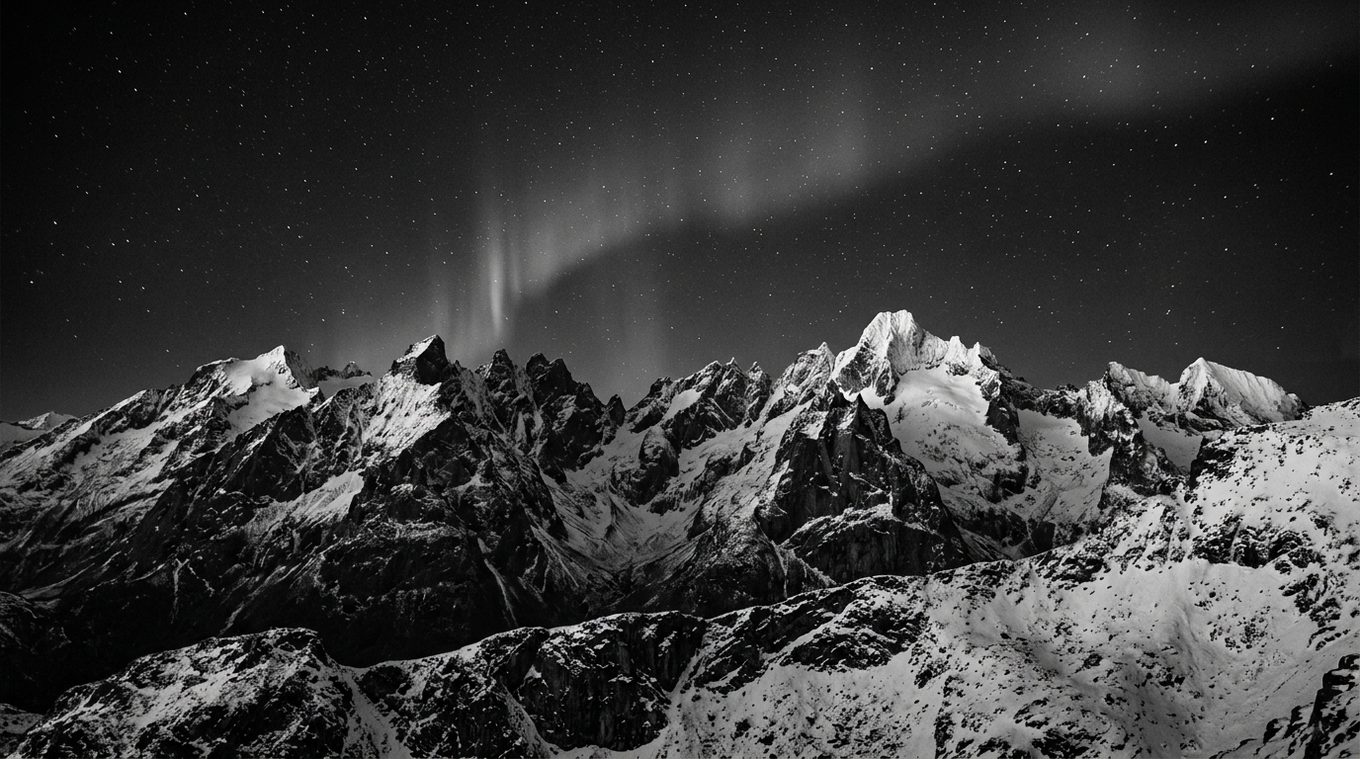 The Ankora Linux default wallpaper: a snowy mountain ridge under a starry sky